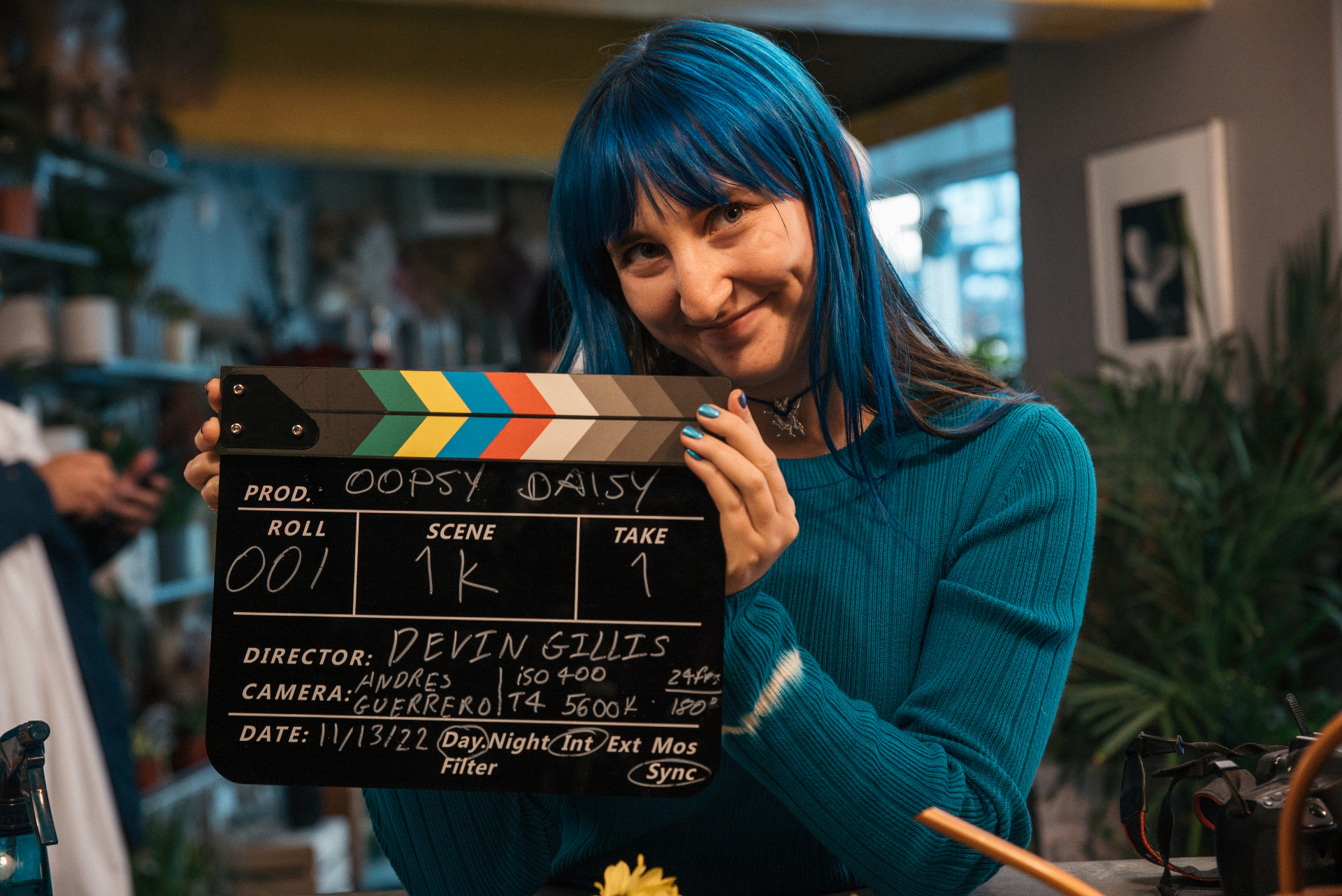 Devin Gillis holding an Oopsy Daisy clapperboard